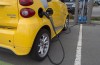 An electric car is seen getting charged at parking lot in Tsawwassen, near Vancouver B.C., Friday, April, 6, 2018. The Canadian auto industry says federal budget programs for electric vehicles and charging stations aren't enough to reach the government's ambitious new sales targets.THE CANADIAN PRESS/Jonathan Hayward