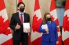 Finance Minister and Deputy Prime Minister Chrystia Freeland and Prime Minister Justin Trudeau speak with members of the media before the release of the federal budget, on Parliament Hill, in Ottawa, Thursday, April 7, 2022. Canada's premiers say they're disappointed the federal government didn't put forward a sustainable plan to financially shore up the country's ailing health systems in its newly tabled budget. THE CANADIAN PRESS/Sean Kilpatrick