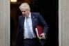 FILE - Britain's Prime Minister Boris Johnson leaves 10 Downing Street to attend the weekly Prime Ministers' Questions session in parliament in London, on March 30, 2022. U.K. Prime Minister Boris Johnson’s office says he will be issued a fine for breaching COVID-19 regulations following allegations of lockdown parties at government offices. Treasury Chief Rishi Sunak will also be fined. (AP Photo/Frank Augstein)