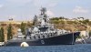 FILE - The Russian missile cruiser Moskva, the flagship of Russia's Black Sea Fleet is seen anchored in the Black Sea port of Sevastopol, on Sept. 11, 2008. The Russian Defense Ministry confirmed the ship was damaged Wednesday, April 13, 2022, but not that it was hit by Ukraine. The Ministry says ammunition on board detonated as a result of a fire whose causes 