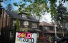 A sold sign is shown in front of west-end Toronto homes, Sunday, May 14, 2017. THE CANADIAN PRESS/Graeme Roy