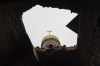 A hole in the roof of a damaged church, in Lukashivka, near the city of Chernihiv in northern Ukraine, on Friday, April 22, 2022. A single metal cross remains inside the Orthodox church of shattered brick and blackened stone. Residents say Russian soldiers used the house of worship for storing ammunition, and Ukrainian forces shelled the building to make the Russians leave. (AP Photo/Petros Giannakouris)