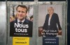 Presidential campaign posters of French President and centrist candidate for reelection Emmanuel Macron, left, and French far-right presidential candidate Marine Le Pen, in Salies de Bearn, southwestern France, Saturday, April 23, 2022. French President Emmanuel Macron is facing off against far-right challenger Marine Le Pen in France's April 24 presidential runoff. (AP Photo/Bob Edme)