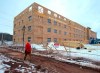 A man walks past an affordable housing complex being constructed in Charlottetown's Hillsborough Park area, on Saturday, Feb. 29, 2020. About $7.9 million from the federal government will go toward building affordable housing in Charlottetown. THE CANADIAN PRESS/Andrew Vaughan