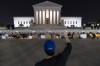 A crowd of people gather outside the Supreme Court early Tuesday, May 3, 2022, in Washington. A draft opinion suggests the U.S. Supreme Court could be poised to overturn the landmark 1973 Roe v. Wade case that legalized abortion nationwide, according to a Politico report released Monday. Whatever the outcome, the Politico report represents an extremely rare breach of the court's secretive deliberation process, and on a case of surpassing importance. (AP Photo/Alex Brandon)