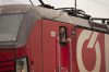 A train driver looks out of his locomotive at the arriving of a Ukrainian freight train with fodder maize, in Vienna, Austria, Friday, May 6, 2022. (AP Photo/Theresa Wey)