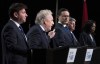 Conservative leadership candidates Jean Charest and Pierre Poilievre spar as Roman Baber, Scott Aitchisonand Leslyn Lewis look on during a debate at the Canada Strong and Free Network conference in Ottawa on Thursday, May 5, 2022. THE CANADIAN PRESS/Adrian Wyld