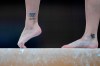 A Canadian gymnast performs on the balance beam during the women's artistic gymnastic qualifications at the 2020 Summer Olympics, Sunday, July 25, 2021, in Tokyo. More than a dozen former Canadian gymnasts have launched a class-action lawsuit claiming lasting physical and psychological damages suffered over many years. (AP Photo/Natacha Pisarenko)