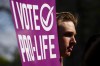 A participant holds a pro-life sign as the Campaign Life Coalition holds a press conference on the front lawn of the Supreme Court of Canada in Ottawa on Wednesday, May 11, 2022. prior to the March For Life on Thursday. THE CANADIAN PRESS/Sean Kilpatrick