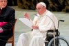 Pope Francis in a wheelchair delivers his address during an audience with members of the Italian Civil Aviation Authority (ENAC) in the Paul VI Hall at The Vatican, Friday, May 13, 2022. Pope Francis suffers from strained ligaments in his right knee. (AP Photo/Andrew Medichini)