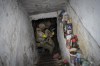 Ukrainian National Guard soldiers inspect a basement during a reconnaissance mission in a recently retaken village on the outskirts of Kharkiv, east Ukraine, Saturday, May 14, 2022. (AP Photo/Bernat Armangue)