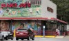 Customers walk to a Trader Joe's market, Aug. 13, 2019, in Cambridge, Mass. Employees of a Trader Joe's grocery store in Hadley, Massachusetts have joined the surge of food service and retail workers nationwide trying to join a union to better their working conditions and benefits. (AP Photo/Charles Krupa, File)