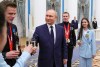 Russian President Vladimir Putin meets with Russian athletes during an awarding ceremony for the Russian Olympic Committee's medalists of the XXIV Olympic Winter Games in Beijing and members of the Russian Paralympic team in the Kremlin in Moscow, Russia, Tuesday, April 26, 2022. (Mikhail Klimentyev, Sputnik, Kremlin Pool Photo via AP)