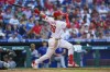 Philadelphia Phillies' Alec Bohm hits a two-run home run during the third inning of a baseball game against the Los Angeles Dodgers, Saturday, May 21, 2022, in Philadelphia. (AP Photo/Chris Szagola)