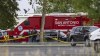 Equipment from the San Antonio Fire Department is parked outside Robb Elementary School in Uvalde, Texas, Tuesday, May 24, 2022, after a gunman entered the school and killed 19 children and two adults. Prime Minister Justin Trudeau has added his voice to a global chorus of grief following the shooting deaths, but emotions in the U.S. have already turned to unbridled anger. (William Luther/The San Antonio Express-News via AP)