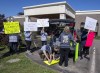 Family and friends of the victims protest outside the hotel where the Mass Casualty Commission inquiry into the April 2020 mass murders in rural Nova Scotia, is being held in Truro, N.S. on Thursday, May 26, 2022. The Mountie in charge of the RCMP's initial response to the mass shooting is expected to testify before the inquiry today, but the public will be barred from hearing what he has to say — at least for the next few days. THE CANADIAN PRESS/Andrew Vaughan