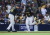 Pittsburgh Pirates third base coach Mike Rabelo celebrates with Ke'Bryan Hayes, who hit a three-run home run against the San Diego Padres during the ninth inning of a baseball game Saturday, May 28, 2022, in San Diego. (AP Photo/Mike McGinnis)