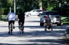 JOHN WOODS / WINNIPEG FREE PRESS
A person in a wheelchair makes their way down Wellington Crescent alongside two cyclists earlier this month. (John Woods / Winnipeg Free press files)