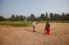 JOHN WOODS / WINNIPEG FREE PRESS
Councillors Lin Dorie (left) and Erin Dorie walk through a field where they performed a smudge ceremony in preparation for a search for unmarked graves on the site of a former residential school in Sagkeeng, (John Woods / Winnipeg Free Press)