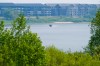 MIKE DEAL / WINNIPEG FREE PRESS
A motor boat zips along the Red River where it runs along River Road in St. Vital.
210729 - Thursday, July 29, 2021.