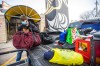 Lolo Hillier, Resource Assistance for Youth employment training program member, unpacks a pickup truck full of winter gear donations on Friday from a memorial held the preivous weekend for Cassandra Sky Woodhouse-Braun-St. Clair. (Mikaela MacKenzie / Winnipeg Free Press)