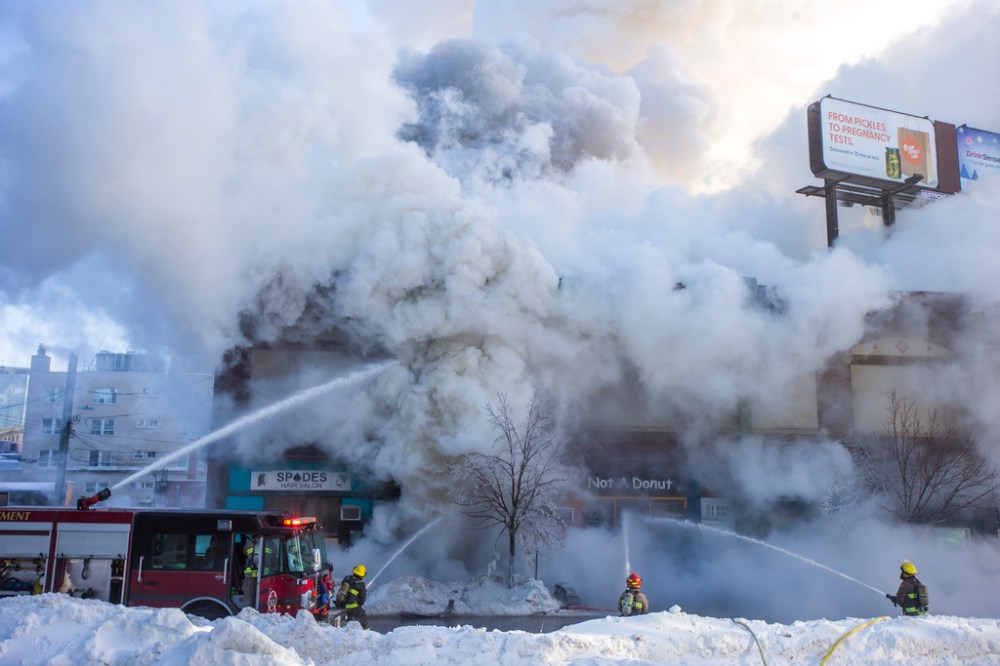 The fire appeared to have started in a church in the two-storey structure. (Mikaela MacKenzie / Winnipeg Free Press)