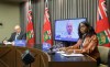 Health Minister Audrey Gordon (right), David Matear, executive director of the diagnostic and surgical recovery task force, and a virtual Dr. Brent Roussin, chief provincial public health officer, during a public health update Thursday. (Mike Deal / Winnipeg Free Press)