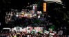 People march down the street towards the Georgia state capitol to protest against the mistreatment of black people and to press for policy change, Monday, June 15, 2020, in Atlanta. The NAACP March to the Capitol Monday coincided with the restart of the Georgia 2020 General Assembly. (AP Photo/Brynn Anderson)