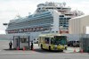 A bus carrying the passengers from the quarantined Diamond Princess cruise ship leaves a port in Yokohama, near Tokyo on February 19, 2020. A Canadian who recently arrived in Canada after being aboard a coronavirus-stricken cruise ship in Japan has tested negative for the illness while under quarantine in Cornwall, Ontario. (Eugene Hoshiko / Canadian Press)