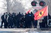 Ontario Provincial Police officers arrest a protester at a rail blockade in Tyendinaga Mohawk Territory, near Belleville, Ont., on Monday Feb. 24, 2020, as they protest in solidarity with Wet'suwet'en Nation hereditary chiefs attempting to halt construction of a natural gas pipeline on their traditional territories. THE CANADIAN PRESS/Adrian Wyld