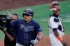 Houston Astros catcher Martin Maldonado looks back as Tampa Bay Rays' Ji-Man Choi celebrates home run during the seventh inning in Game 5 of a baseball American League Championship Series, Thursday, Oct. 15, 2020, in San Diego. (AP Photo/Ashley Landis)