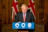 Britain's Prime Minister Boris Johnson listens, during a coronavirus briefing in Downing Street, London, Wednesday, Sept. 30, 2020. The number of new hospitalizations for COVID-19 and virus deaths in Britain are rising again, although both remain far below their springtime peak. (Jack Hill/Pool Photo via AP)