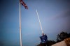 FILE - In this Friday, Jan. 31, 2020 file photo, a worker folds the EU flag after being lowered at the British territory of Gibraltar. While corks may have popped in London and Brussels over the end to the Brexit negotiations, there was one rocky speck of British soil still left in limbo. Gibraltar, a British colony jutting off Spain’s southern tip, was not included in the deal announced on Christmas Eve between the European Union and the United Kingdom to reorganize the commercial and trade relations between the now 27-member bloc and the first nation to exit the group. (AP Photo/Javier Fergo, File)