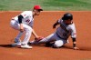 Arizona Diamondbacks' Daulton Varsho, right, is tagged out at second base by Los Angeles Angels shortstop Andrelton Simmons during the first inning of a baseball game Thursday, Sept. 17, 2020, in Anaheim, Calif. (AP Photo/Marcio Jose Sanchez)