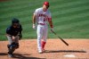 Los Angeles Angels' Mike Trout, right, reacts after striking out during the sixth inning of a baseball game against the Seattle Mariners in Anaheim, Calif., Monday, Aug. 31, 2020. (AP Photo/Kyusung Gong)