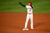 Los Angeles Angels designated hitter Shohei Ohtani waves to the dugout after arriving at second base off a single by Albert Pujols during the fourth inning of a baseball game against the Oakland Athletics in Anaheim, Calif., Tuesday, Aug. 11, 2020. (AP Photo/Kelvin Kuo)
