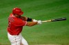 Los Angeles Angels' Albert Pujols follows through on a swing for a two-run double during the fifth inning of a baseball game against the San Francisco Giants in Anaheim, Calif., Monday, Aug. 17, 2020. (AP Photo/Kelvin Kuo)