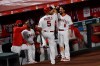 Los Angeles Angels' Albert Pujols (5) celebrates with Anthony Rendon while heading into the dugout after a solo home run during the fifth inning of the team's baseball game against the Seattle Mariners in Anaheim, Calif., Tuesday, July 28, 2020. (AP Photo/Kelvin Kuo)