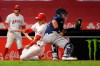 Los Angeles Angels' Jason Castro, center, scores on a double by Brian Goodwin as Seattle Mariners catcher Joseph Odom, right, takes a late throw during the sixth inning of a baseball game Wednesday, July 29, 2020, in Anaheim, Calif. (AP Photo/Mark J. Terrill)