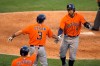 Houston Astros' George Springer, right, is congratulated by Myles Straw, center, and Jose Altuve after hitting a two-run home run during the ninth inning of a baseball game against the Los Angeles Angels, Saturday, Aug. 1, 2020, in Anaheim, Calif. (AP Photo/Mark J. Terrill)