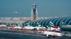 FILE - In this Dec. 11, 2019, file photo, an Emirates jetliner comes in for landing at Dubai International Airport in Dubai, United Arab Emirates. Dubai International Airport, the world's busiest for international travel, said Thursday, Jan. 23, 2020, that it is taking special precautions to screen the droves of Chinese tourists expected for the Lunar New Year holiday after the outbreak of a pneumonia-like virus that has led to China's lockdown of the entire city of Wuhan. (AP Photo/Jon Gambrell, File)