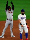 Arizona Diamondbacks Eduardo Escobar (5) celebrates a double against the Texas Rangers in the first inning as Texas Rangers second baseman Rougned Odor walks away during a baseball game Tuesday, July 28, 2020 in Arlington, Texas. (AP Photo/Richard W. Rodriguez)