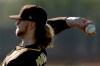 San Diego Padres pitcher Chris Paddack throws during spring training baseball practice Saturday, Feb. 15, 2020, in Peoria, Ariz. (AP Photo/Charlie Riedel)