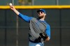 Kansas City Royals' Alex Gordon throws a ball during spring training baseball practice Monday, Feb. 17, 2020, in Surprise, Ariz. (AP Photo/Charlie Riedel)
