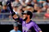 Colorado Rockies' David Dahl celebrates as he crosses the plate after hitting a solo home run during the fifth inning of a spring training baseball game against the Seattle Mariners Monday, March 2, 2020, in Peoria, Ariz. (AP Photo/Charlie Riedel)