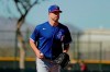 Texas Rangers pitcher Corey Kluber participates in a drill during spring training baseball practice Friday, Feb. 14, 2020, in Surprise, Ariz. (AP Photo/Charlie Riedel)
