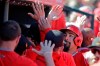 Los Angeles Angels' Anthony Rendon celebrates with teammates after scoring during the first inning of a spring training baseball game against the Cincinnati Reds, Tuesday, Feb. 25, 2020, in Tempe, Ariz. (AP Photo/Darron Cummings)