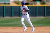 Chicago Cubs third baseman Kris Bryant runs the bases during spring training baseball practice Tuesday, Feb. 18, 2020, in Mesa, Ariz. (AP Photo/Gregory Bull)