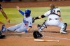CORRECTS TO GROUND BALL, INSTEAD OF BASE HIT - Los Angeles Dodgers' A.J. Pollock scores on a ground ball by Chris Taylor as Arizona Diamondbacks catcher Daulton Varsho makes the late tag during the 10th inning of a baseball game Tuesday, Sept. 8, 2020, in Phoenix. (AP Photo/Matt York)
