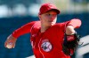 Cincinnati Reds starting pitcher Sonny Gray throws against the Seattle Mariners during the first inning of a spring training baseball game Wednesday, Feb. 26, 2020, in Goodyear, Ariz. (AP Photo/Ross D. Franklin)